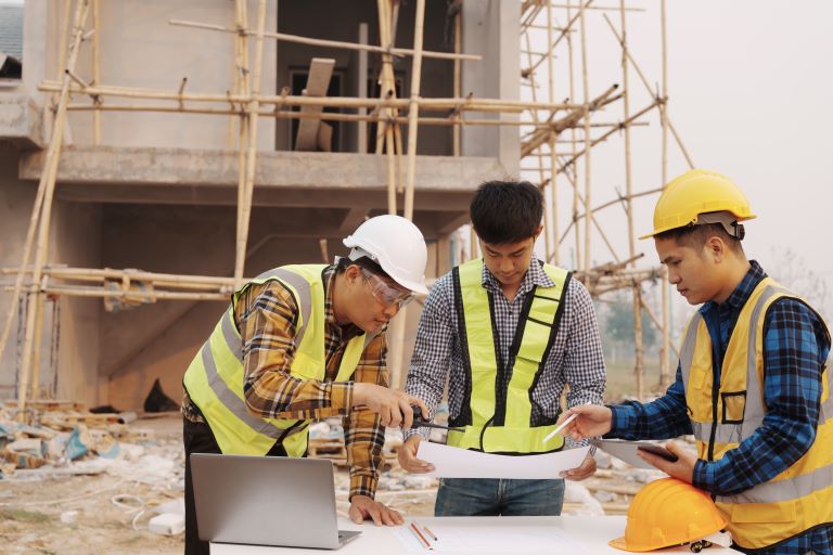 Construction workers scoping out a site | Improve customer satisfaction